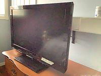 Front three-quarter view of Panasonic 32-inch TV on stand