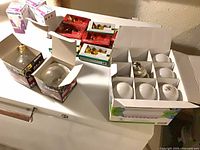 Open box of white A19 LED bulbs and two Globe Edison bulbs