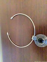 Full view of choker necklace front, showing concentric ring pendant and open cuff ends