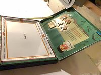 Opened box showing platter and markers inside packaging