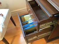 Open bottom file drawer with hanging rails and upper drawer