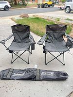 pair of Coleman folding chairs with carry bag
