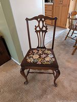 Full view of chair showing frame, legs, upholstery