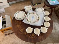 Assorted dinnerware set displayed on table