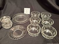 Group view of six bowls, jam jar with lid, two plates