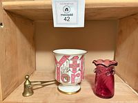 Group shot showing goblet, candle snuffer, and vase