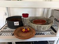 Group view of pot, dishes, basket, feeder, bucket