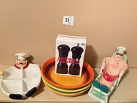 Group shot of entire lot: chef dishes, stacked pasta bowls, boxed mills
