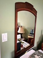 Full view of mirror showing frame and reflection