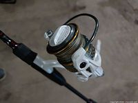 Close-up of Abu Garcia MaxPro 30 spinning reel mounted on rod