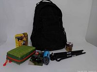 Overall lot with backpack and accessories displayed