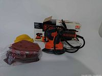 Sander, sandpaper bundle, sanding block, original box