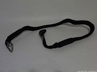 Full view of black braided bungee tether showing carabiner and loop