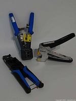 Overview of three cable crimpers standing upright
