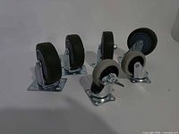 Five of six caster wheels showing relative sizes and mounts