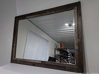 Full view of rectangular mirror mounted on wall