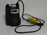Full view of pump with power cord coiled