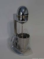 Full view of Farberware drink mixer with cup wrapped in plastic
