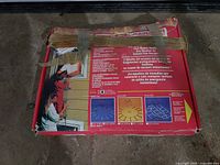 Closed box showing product information and tape