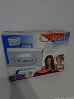 Front of boxed Helen of Troy Carel model 173005 soft bonnet hair dryer