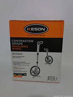 Front of unopened Keson contractor grade measuring wheel box