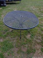 Top view of oval metal mesh patio table