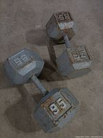 Full view of both 95 lb hex dumbbells
