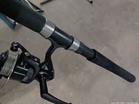 Close-up of reel seat, handle and mounted Wrath reel