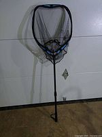 Full view of folded landing net extended