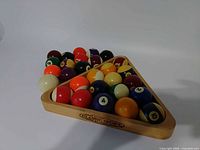 Full set of balls arranged in wooden rack