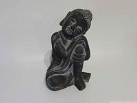 Full view of seated Buddha statue