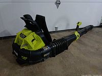 Side view of Ryobi 40V backpack blower with tube attached