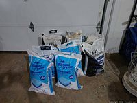 Group of ten salt bags on floor