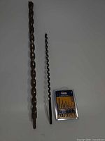 Full view of two auger bits and packaged Hanson set on white background
