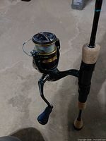 Shimano 2500 spinning reel attached to St. Croix rod, showing reel body, spool, handle, cork grip