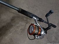 Close-up of Abu Garcia spinning reel attached to rod handle