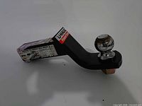Full view of U-Haul ball mount showing overall condition and included pin