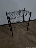 Full view of three-tier black wire shelving unit