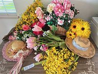 All items overview: assorted artificial flower bundles, basket arrangement, two straw hats