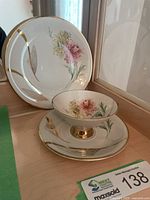 Tea trio arranged showing front decoration