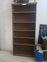 Front view showing six shelves and overall condition