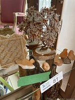 Overview of beaded tree, four stone animals, stitched box