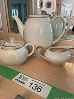Teapot, sugar bowl, creamer displayed together