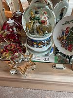 Group shot showing plate, snow globe, star holder, plaid candles and Dreamlight votive