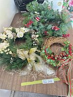Overall view of two wreaths and garland on table