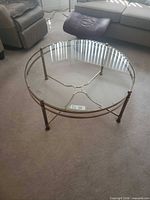 Top view of round brass and glass coffee table