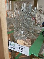 Vase, sugar bowl and cross inside cabinet