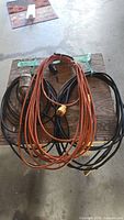 Overall lot showing orange and black cords plus trouble light