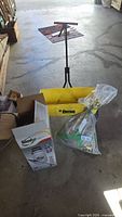 Overall lot showing spreader, fertilizer bag, sprayer box