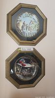 Both framed plates displayed vertically